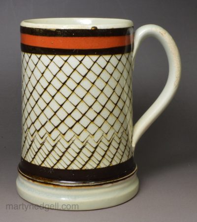 Pearlware pottery mug decorated with inlaid slip, circa 1820