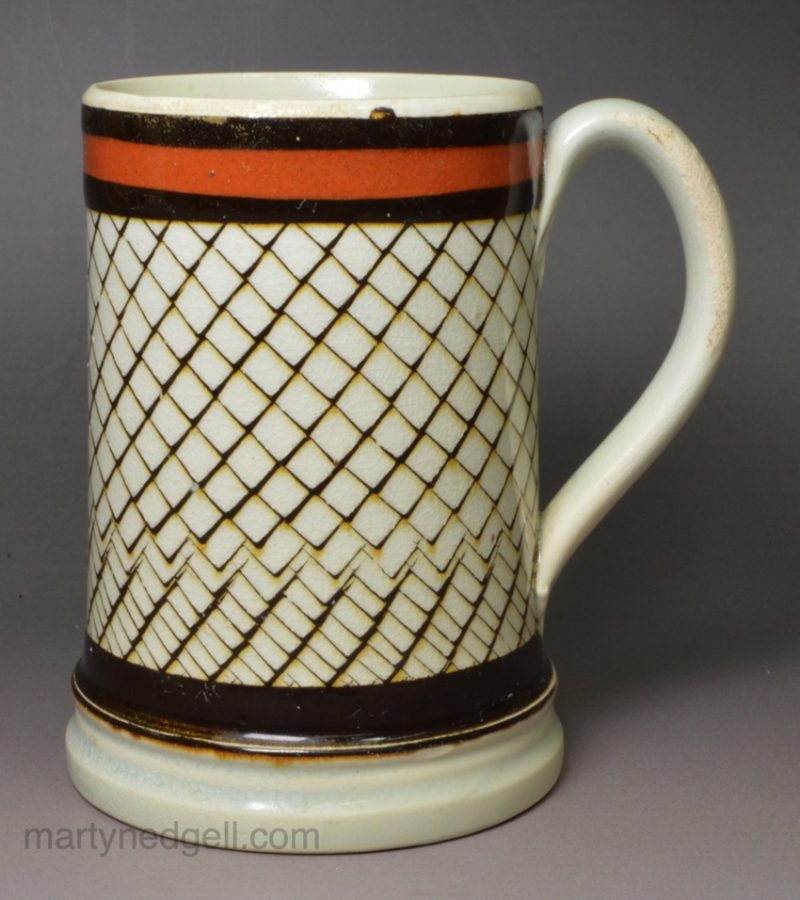 Pearlware pottery mug decorated with inlaid slip, circa 1820