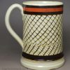 Pearlware pottery mug decorated with inlaid slip, circa 1820