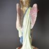 Staffordshire pearlware pottery figural candlestick decorated with overglaze enamels, circa 1820