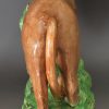 Pearlware pottery lion decorated with enamels over the glaze, circa 1810