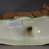 Pearlware pottery lion decorated with enamels over the glaze, circa 1810