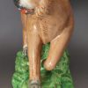 Pearlware pottery lion decorated with enamels over the glaze, circa 1810
