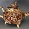 Creamware pottery teapot decorated with Whieldon type colour under the glaze, circa 1770