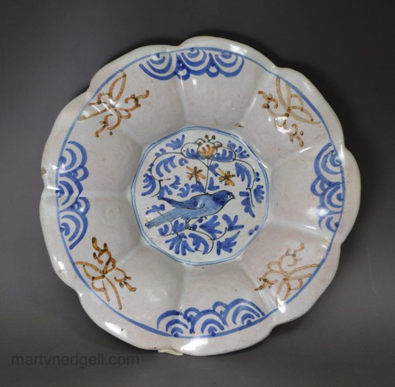 London delft buckle dish decorated with three colours, circa 1660