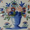 London Delft blue, red and green floral tile, circa 1730