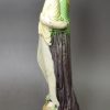 Creamware pottery figure of Charity decorated with colours under the glaze, circa 1795, probably Ralph Wood Pottery Staffordshire