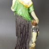 Creamware pottery figure of Charity decorated with colours under the glaze, circa 1795, probably Ralph Wood Pottery Staffordshire