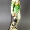 Creamware pottery figure of Charity decorated with colours under the glaze, circa 1795, probably Ralph Wood Pottery Staffordshire