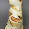 Creamware pottery cat decorated with splashes of slip, circa 1790, probably Bovey Tracey Pottery