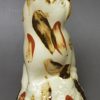 Creamware pottery cat decorated with splashes of slip, circa 1790, probably Bovey Tracey Pottery