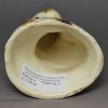 Creamware pottery cat decorated with splashes of slip, circa 1790, probably Bovey Tracey Pottery