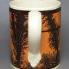 Creamware pottery mug decorated with tan slip and dendritic mochaware markings, circa 1820