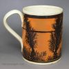 Creamware pottery mug decorated with tan slip and dendritic mochaware markings, circa 1820
