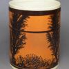 Creamware pottery mug decorated with tan slip and dendritic mochaware markings, circa 1820