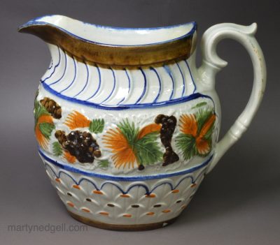 Prattware pottery jug decorated with colours under the glaze, circa 1880