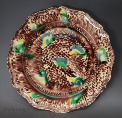 Creamware pottery plate decorated with Whieldon type colours under the glaze, circa 1770
