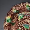 Creamware pottery plate decorated with Whieldon type colours under the glaze, circa 1770