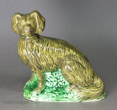 Pearlware pottery figure of a spaniel decorated with colours under the glaze, circa1790