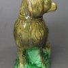 Pearlware pottery figure of a spaniel decorated with colours under the glaze, circa1790