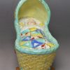 Pearlware pottery child's toy cradle and baby, circa
