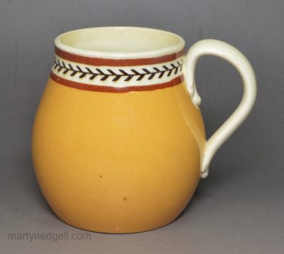 Creamware pottery mustard pot decorated with slip and inlayed slip, circa 1820