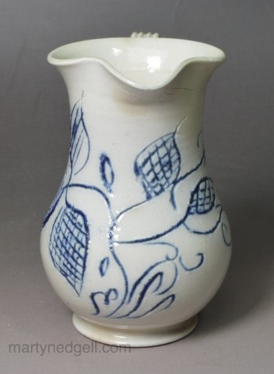 Small Staffordshire white saltglaze stoneware jug with scratch blue decoration, circa 1760