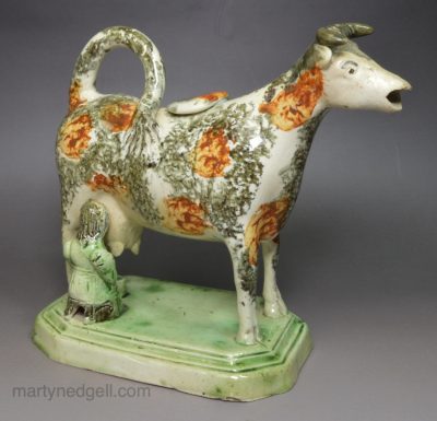 Pearlware pottery cow creamer with sponge decoration, circa 1820