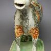 Pearlware pottery cow creamer with sponge decoration, circa 1820