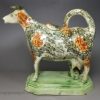 Pearlware pottery cow creamer with sponge decoration, circa 1820