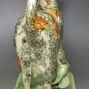 Pearlware pottery cow creamer with sponge decoration, circa 1820