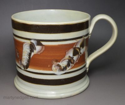 Pearlware pottery mug decorated in brown slip, circa 1830