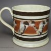 Pearlware pottery mug decorated in brown slip, circa 1830