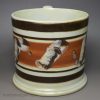 Pearlware pottery mug decorated in brown slip, circa 1830