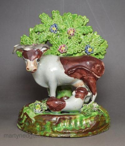 Pearlware pottery cow and calf bocage figure, circa 1820