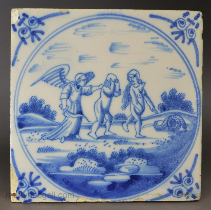 Dutch Delft biblical tile of Adam and Eve getting cast out of Eden, circa 1750