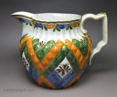 Prattware pottery pineapple moulded jug decorated with colours under a pearlware glaze, circa 1820