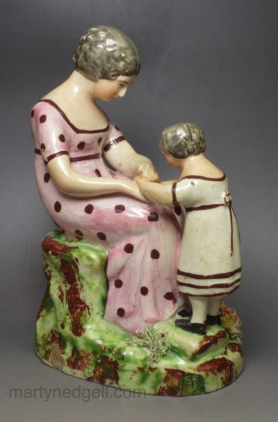 Staffordshire pearlware pottery figure of a mother and daughter, circa 1820