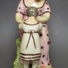Staffordshire pearlware pottery figure of a mother and daughter, circa 1820