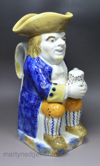 Prattware pottery Toby Jug decorated with colours under a pearlware glaze, circa 1820