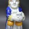 Prattware pottery Toby Jug decorated with colours under a pearlware glaze, circa 1820