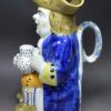 Prattware pottery Toby Jug decorated with colours under a pearlware glaze, circa 1820