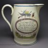 Creamware pottery jug decorated with a Napoleonic cartoon, circa 1815 JOHN BULL peppering BUONAPARTE in the FRONT and REAR