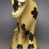 Yorkshire type buff coloured pottery cow and calf, circa 1820