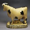 Yorkshire type buff coloured pottery cow and calf, circa 1820