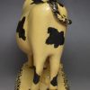 Yorkshire type buff coloured pottery cow and calf, circa 1820