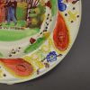 Pearlware pottery child's plate decorated with a print 'GOING TO SCHOOL' and overglaze enamels, circa 1820