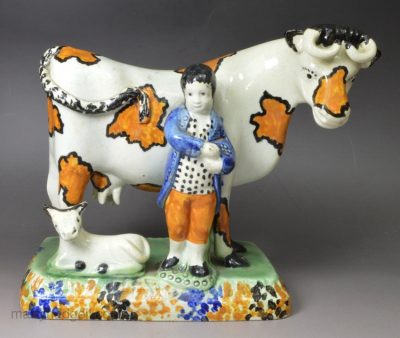 Yorkshire type prattware pottery model of a cow with attendant, circa 1820