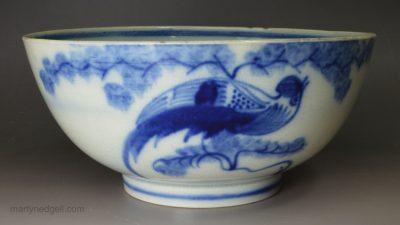 Pearlware pottery bowl painted with a blue bird under the glaze, circa 1820