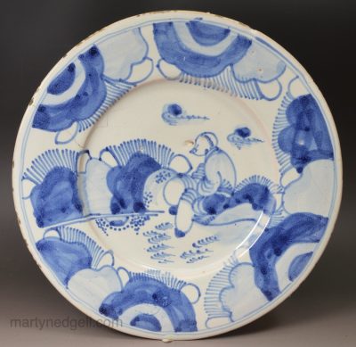 London delft plate painted in blue with a seated Chinese man, circa 1680